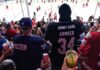 Fans enjoying Hinny Hard Seltzer at a hockey game.